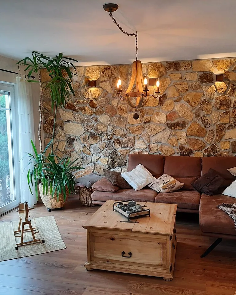 12 Ways to Cover an Ugly Ceiling Without Making the Room Feel Heavy 13 Cozy living room with warm layered decor