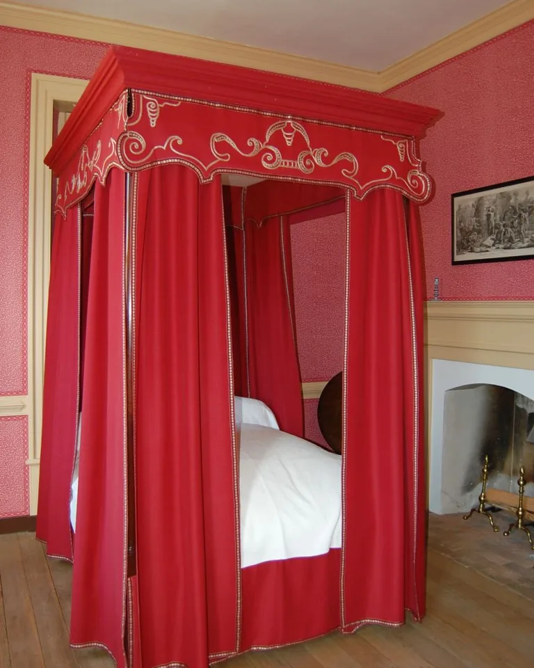 11 Cute Bedding Ideas That Make Your Bedroom Feel Like a Dream 9 Bed with sheer canopy draped and warm fairy lights