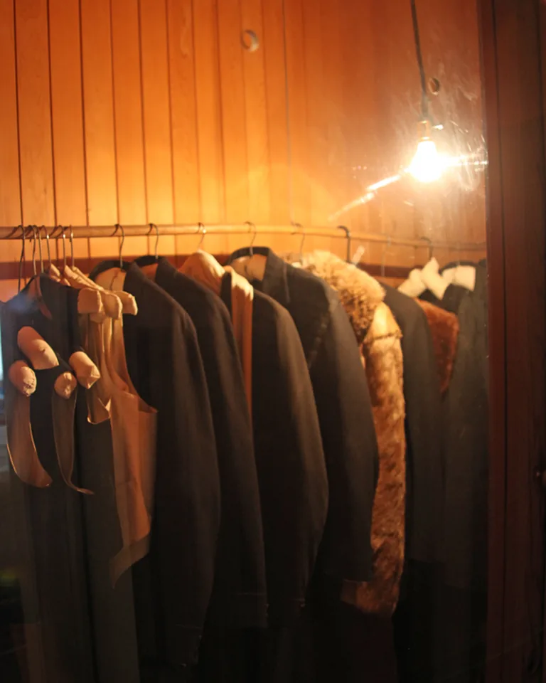 11 Closet Inspo Ideas That Are Organized, Stylish, and Actually Usable 17 Organized walk-in closet with wooden shelving and neatly hung clothes