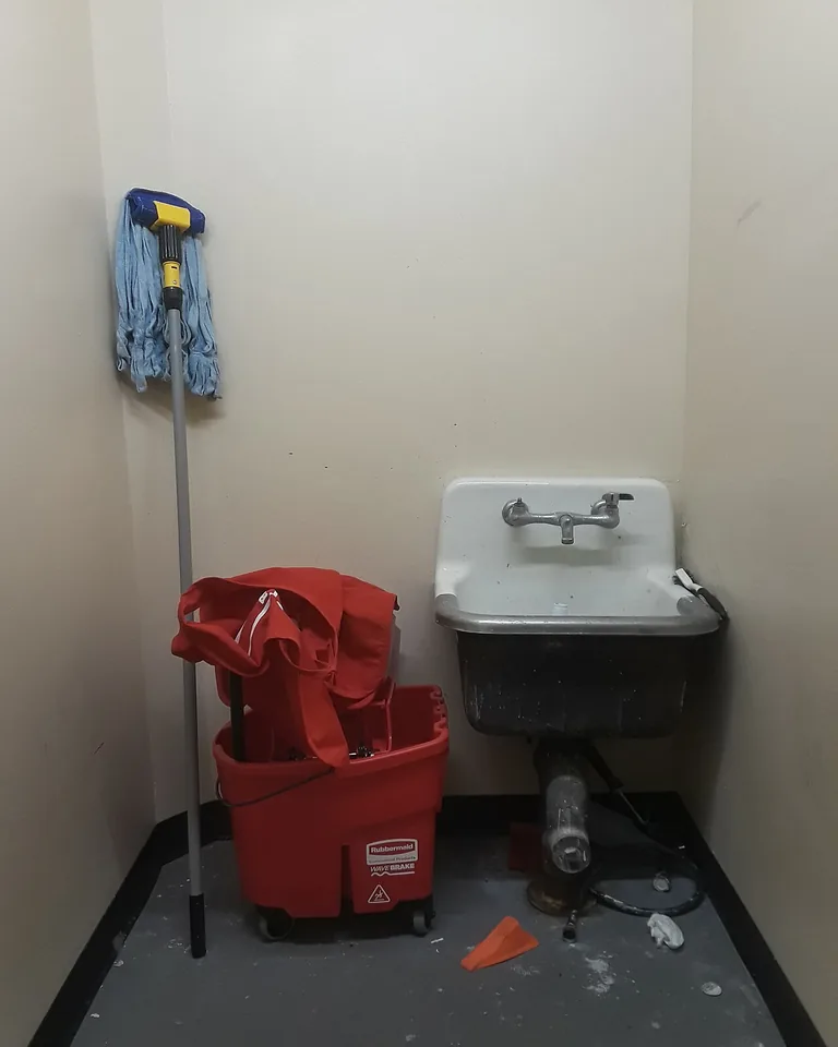 Small reach-in closet with double hanging rods for shirts and pants