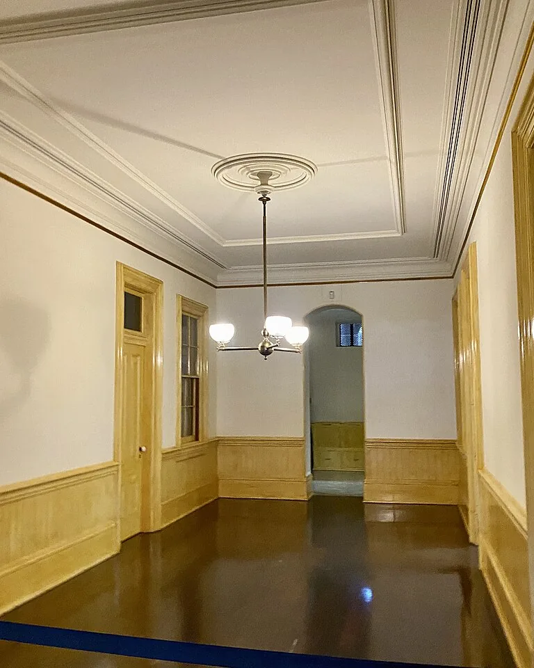 12 Ways to Cover an Ugly Ceiling Without Making the Room Feel Heavy 10 Crisp white paneled ceiling in a finished basement