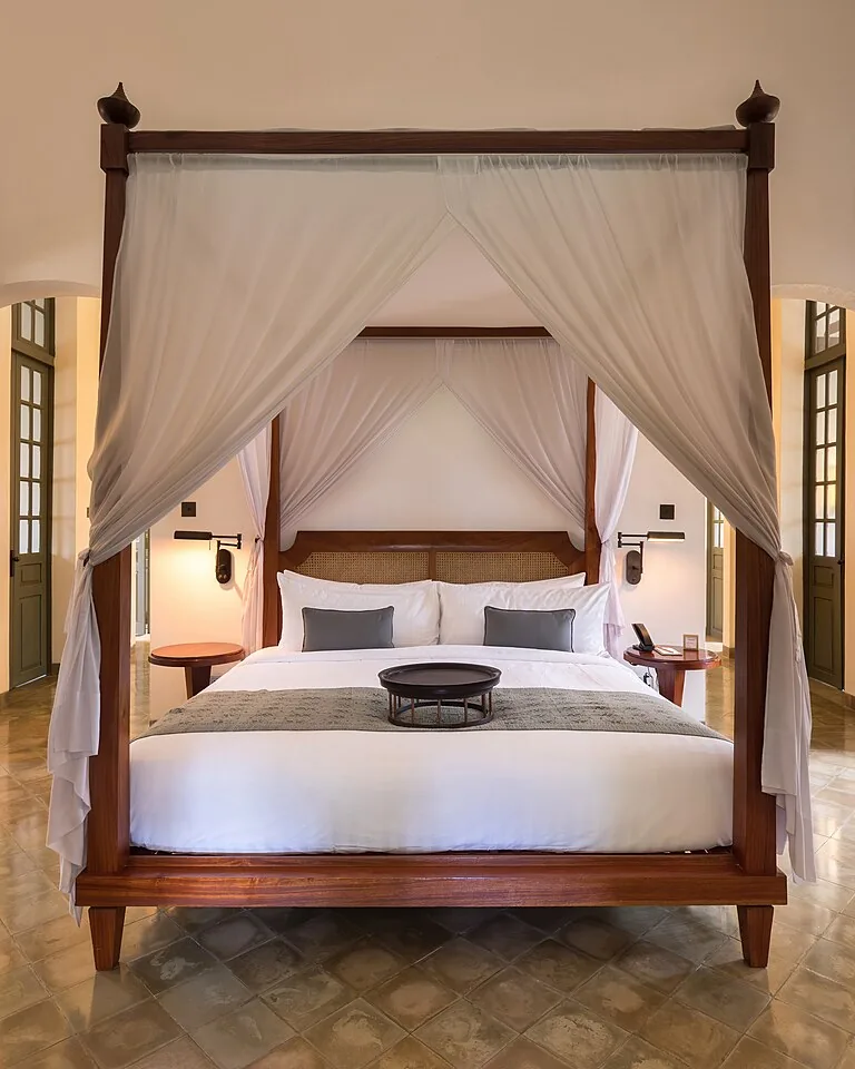 11 Cute Bedding Ideas That Make Your Bedroom Feel Like a Dream 11 Crisp all-white bedding with layered pillows on a made bed