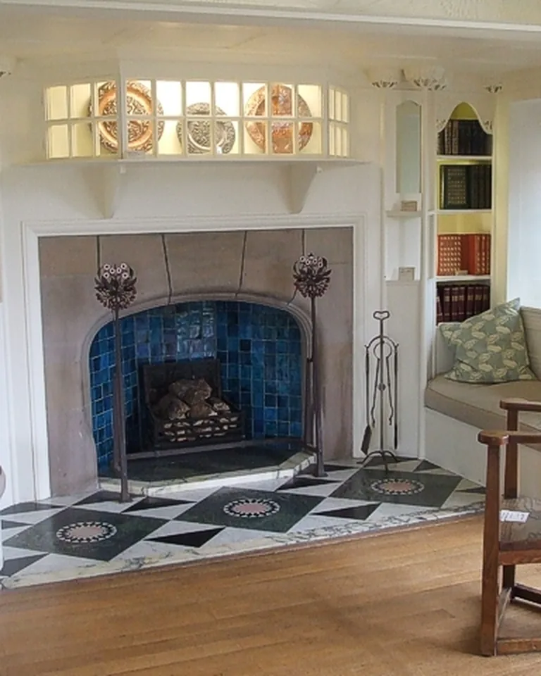 11 Shiplap Fireplace Ideas for a Cozy, Finished Living Room 8 White shiplap accent wall above a fireplace in a bright living room