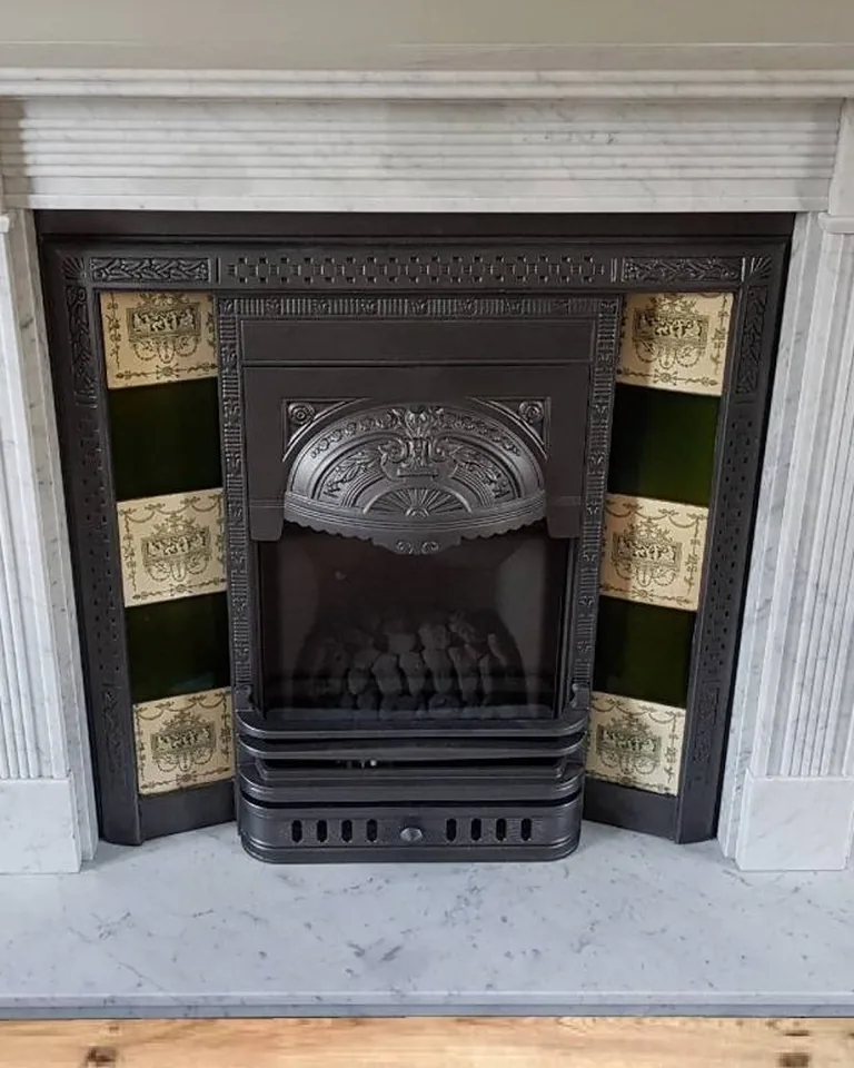 11 Shiplap Fireplace Ideas for a Cozy, Finished Living Room 10 White shiplap fireplace with a clean marble firebox surround