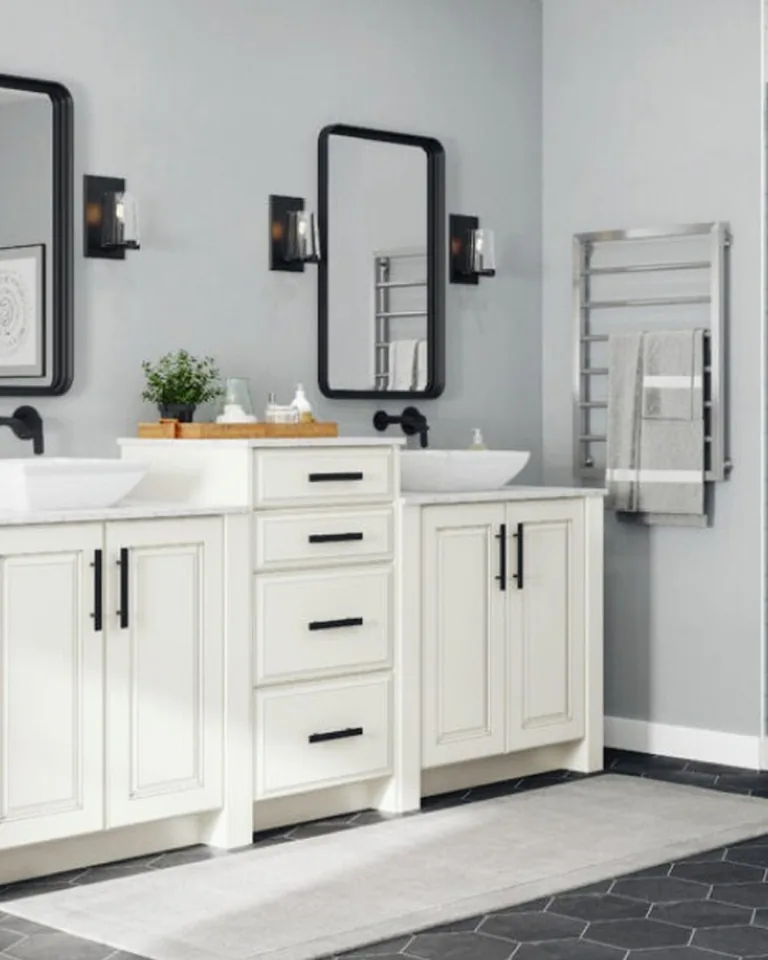 Beige bathroom vanity with mirror and gold hardware