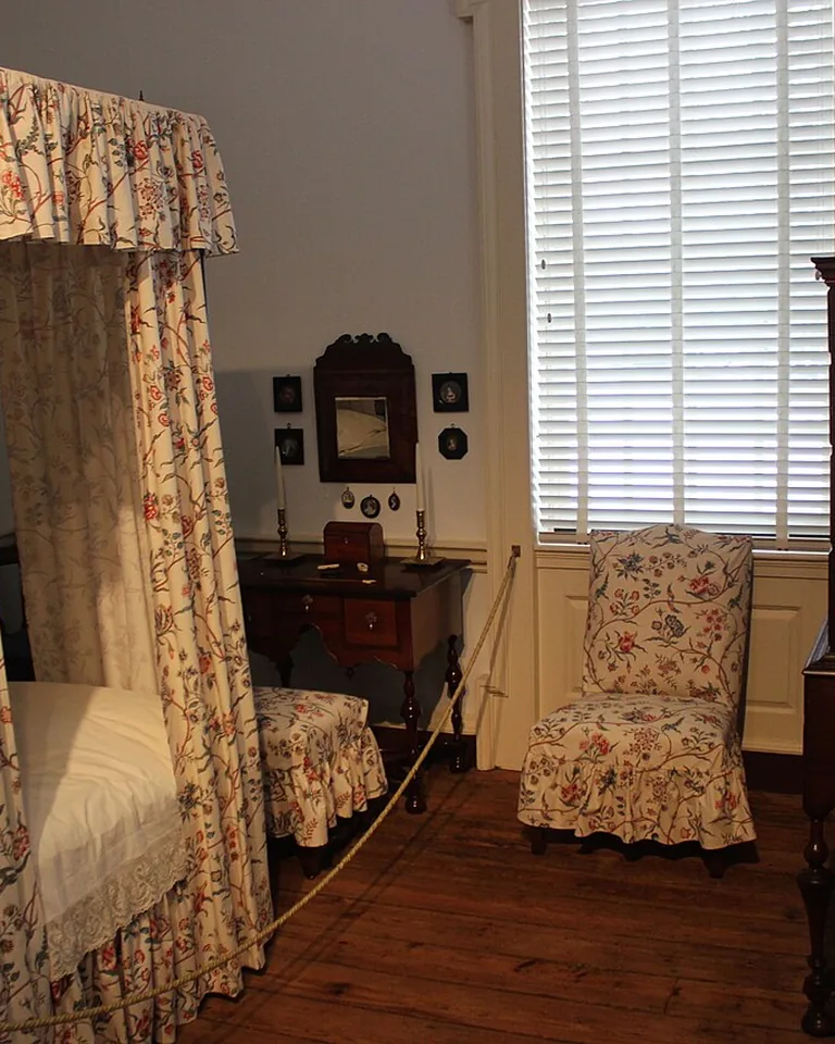 12 Married Couple Bedroom Ideas That Feel Personal and Balanced 8 Floor-length blackout curtains with sheer panels layered on a bedroom window