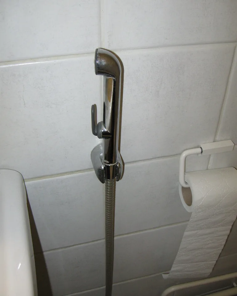 Walk-in shower with gold shower hardware