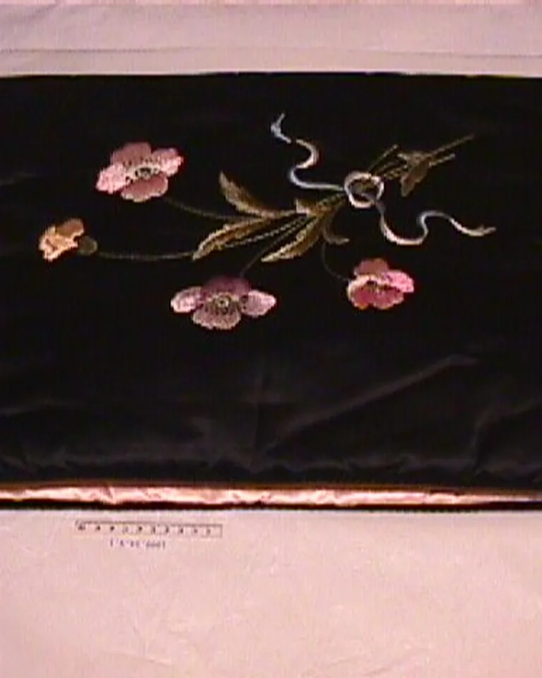 Layered bedding with knit throw and velvet cushions