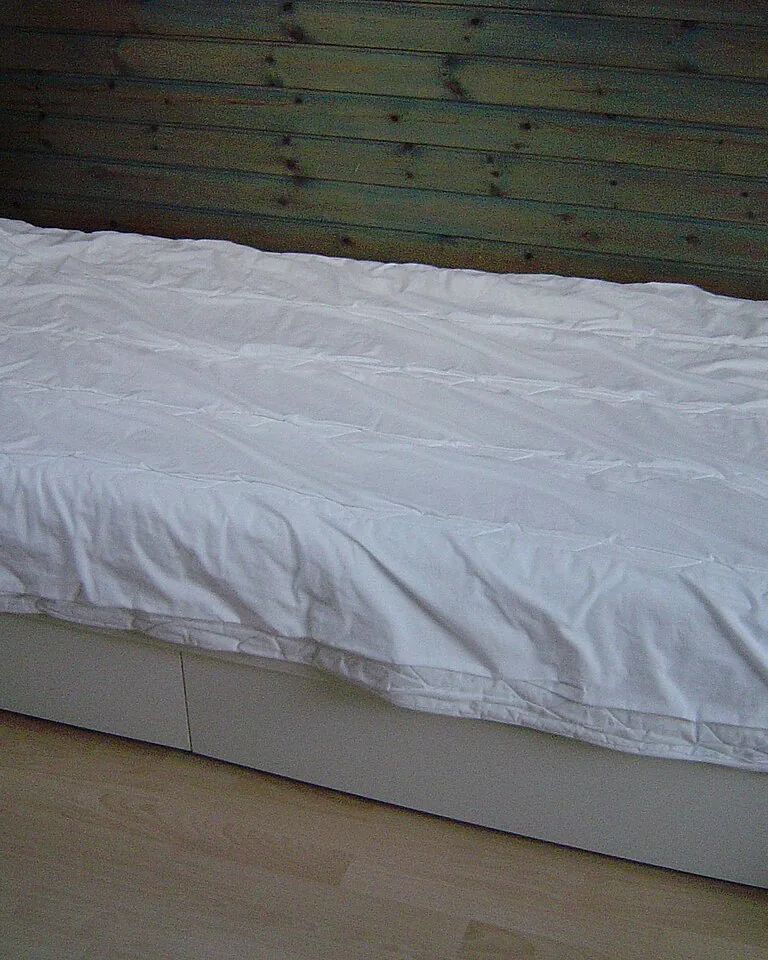 Bed with two separate duvets in matching covers
