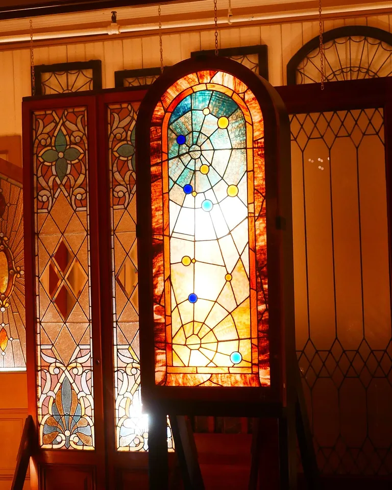 11 Window Painting Ideas for Beautiful Painted Glass (Easy DIY Guide) 3 Stained glass style arches painted across window panes