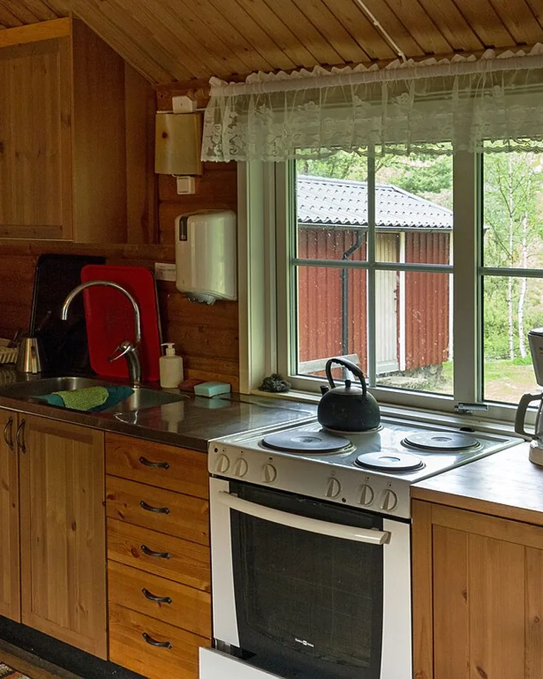 Bright kitchen with a large window over the sink bringing in natural light