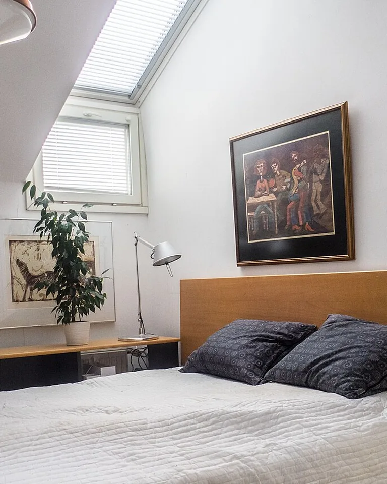 12 Moody Bedding Ideas That Make a Bedroom Feel Rich, Layered, and Intentional 14 Bedside lamps with warm low lighting beside a dark bed