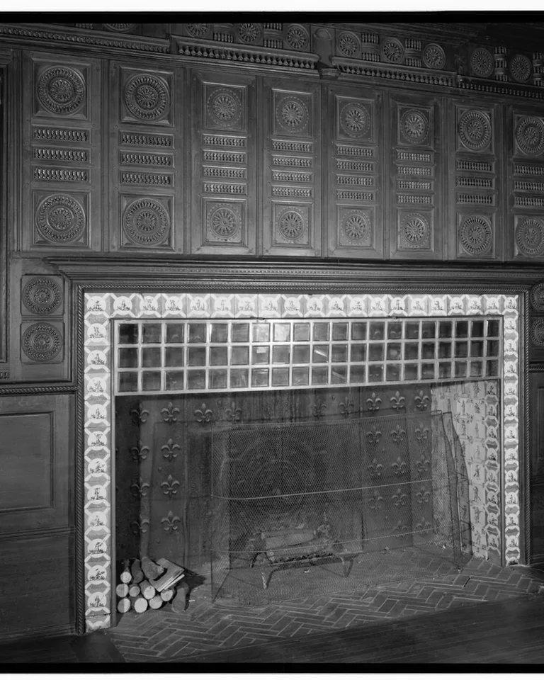 TV placed beside the fireplace on the same wall