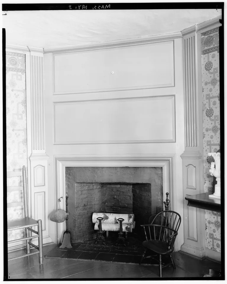Fireplace tucked into a room corner with angled seating
