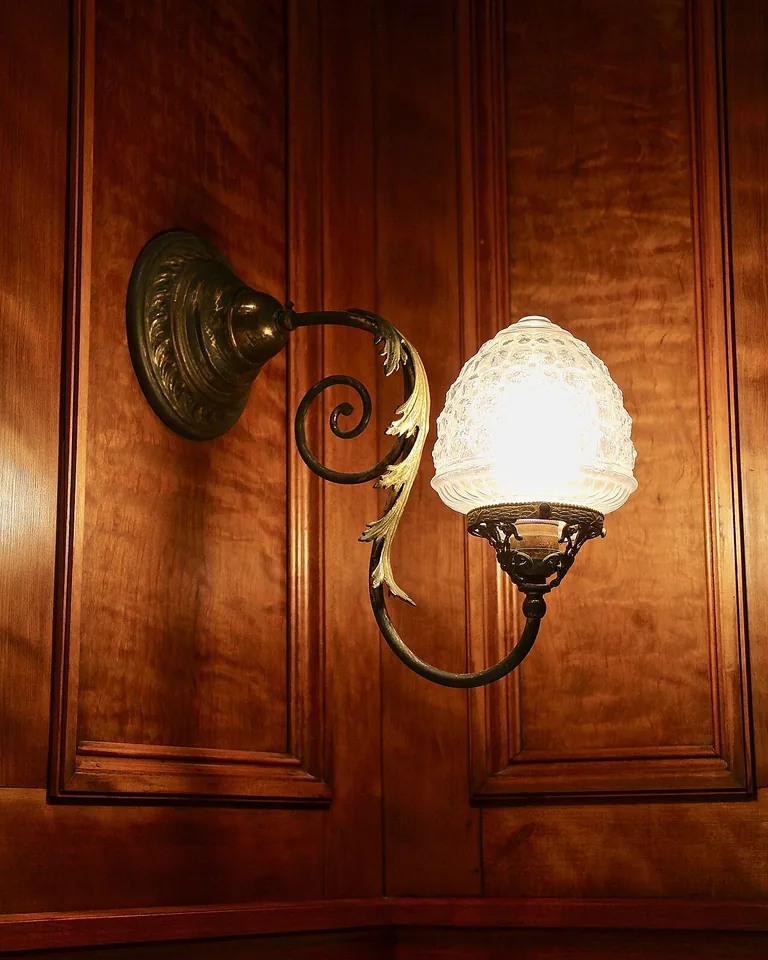 12 Modern Western Bathroom Ideas That Blend Rustic Character With Fresh Style 11 Warm sconce lighting beside a bathroom mirror