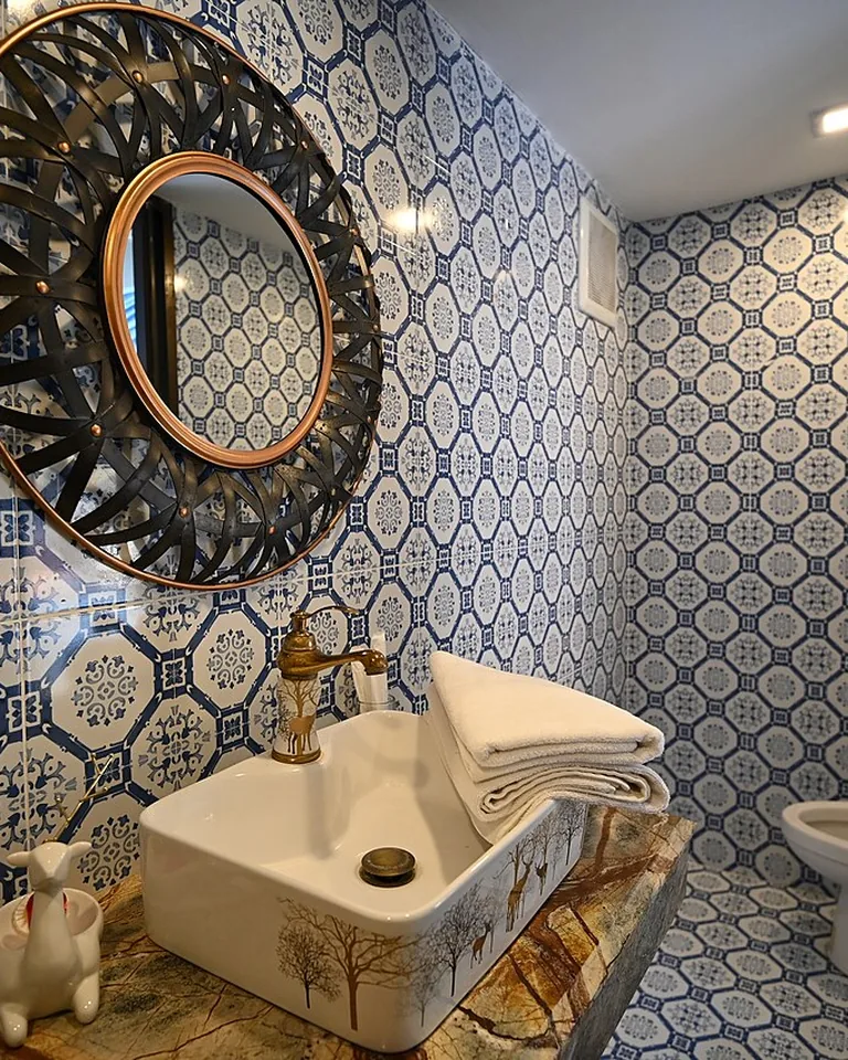 12 Modern Western Bathroom Ideas That Blend Rustic Character With Fresh Style 14 Aged copper faucet with patina on a wood bathroom vanity