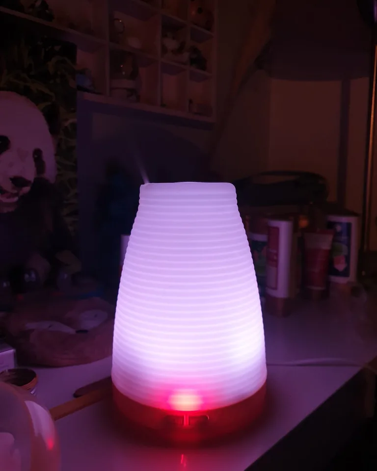 How to Make Your Home Smell Amazing Without Air Fresheners (11 Natural Ways) 4 Ultrasonic essential oil diffuser releasing a fine mist in a living room