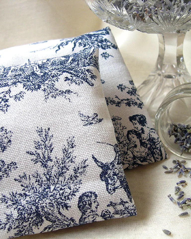 How to Make Your Home Smell Amazing Without Air Fresheners (11 Natural Ways) 9 Scented lavender sachets tucked into a dresser drawer with folded linens