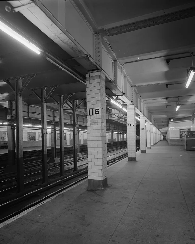 Modern farmhouse bathroom with classic white subway tile walls and wood accents