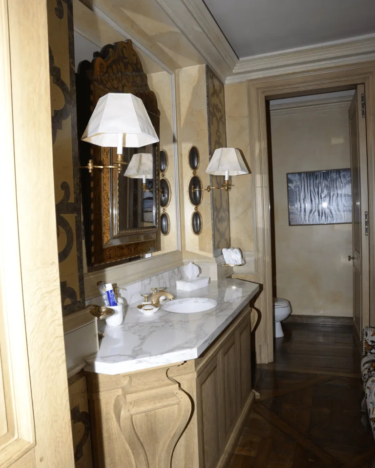 Farmhouse bathroom vanity lighting with warm lantern-style sconces