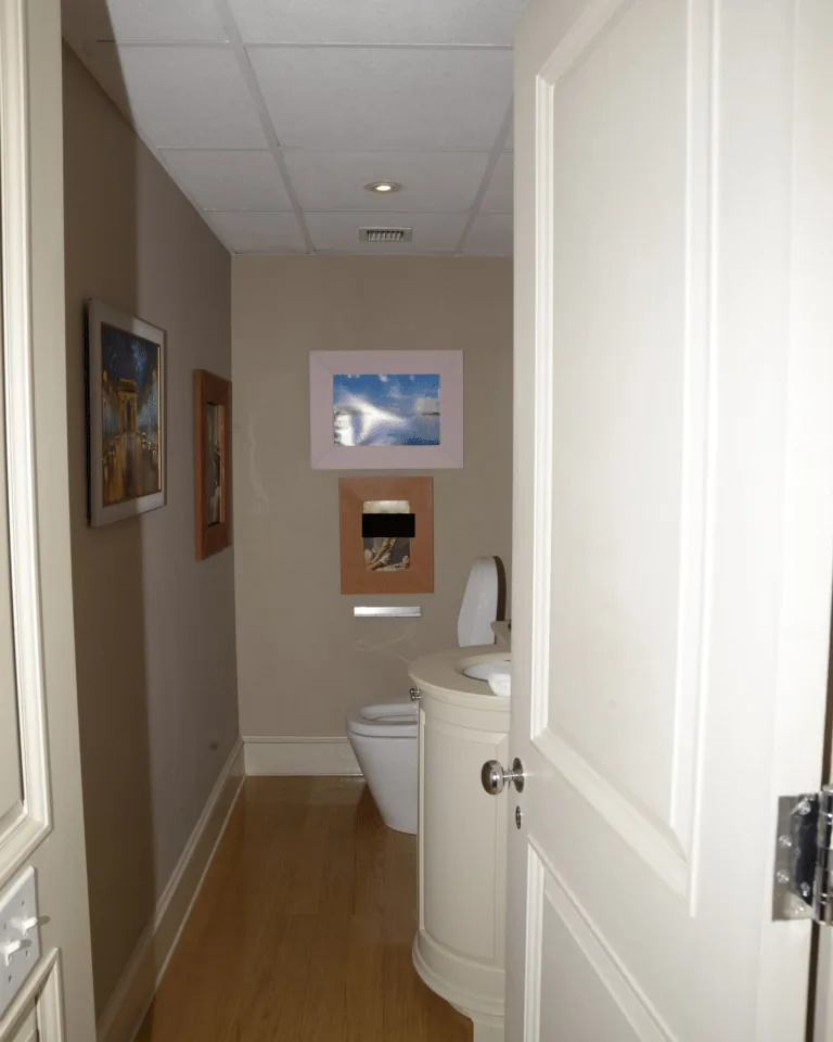 Warm reclaimed wood bathroom vanity with quartz countertop in a farmhouse bathroom