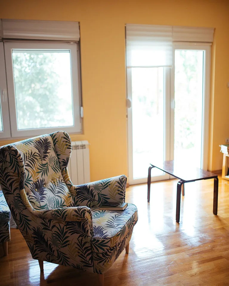 Bright airy living room with natural light streaming through large windows