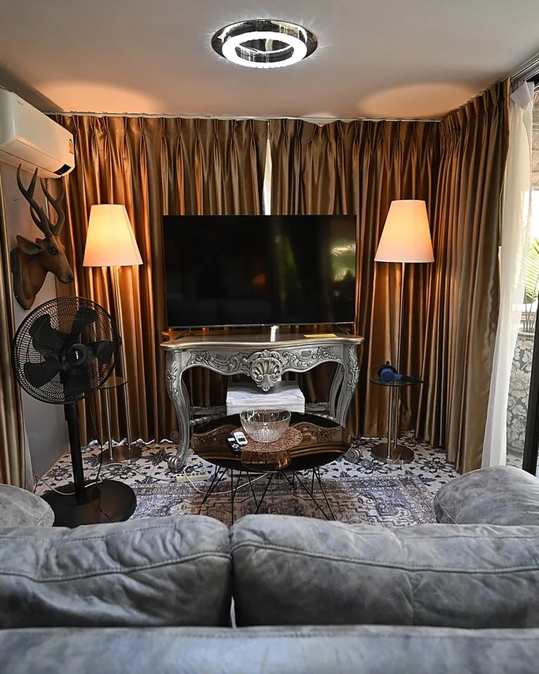 How to Brighten a Dark Room: 15 Fixes That Actually Work 8 Living room with layered lighting from floor lamp table lamp and ceiling light