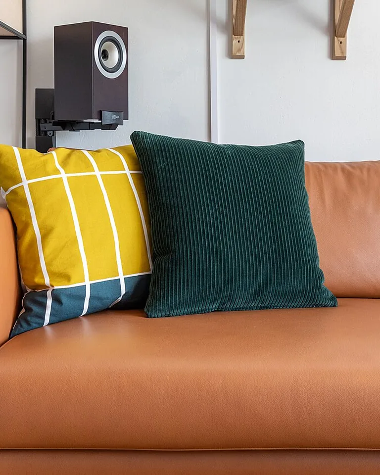 12 Bedding Finishing Touches That Make the Whole Bedroom Feel Complete 9 Square accent pillow with vertical indent designer chop on bed