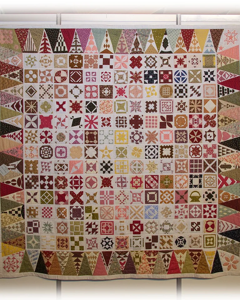 12 Bedding Finishing Touches That Make the Whole Bedroom Feel Complete 5 Quilt folded across foot of bed hotel style