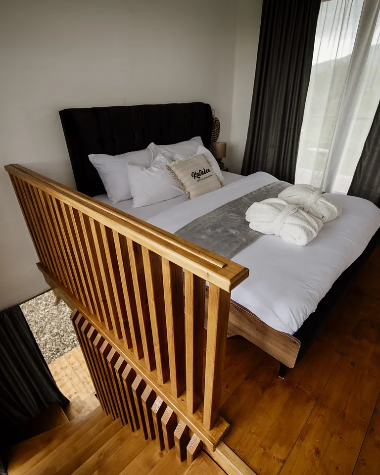 12 Bedding Finishing Touches That Make the Whole Bedroom Feel Complete 6 Throw blanket draped diagonally across corner of made bed