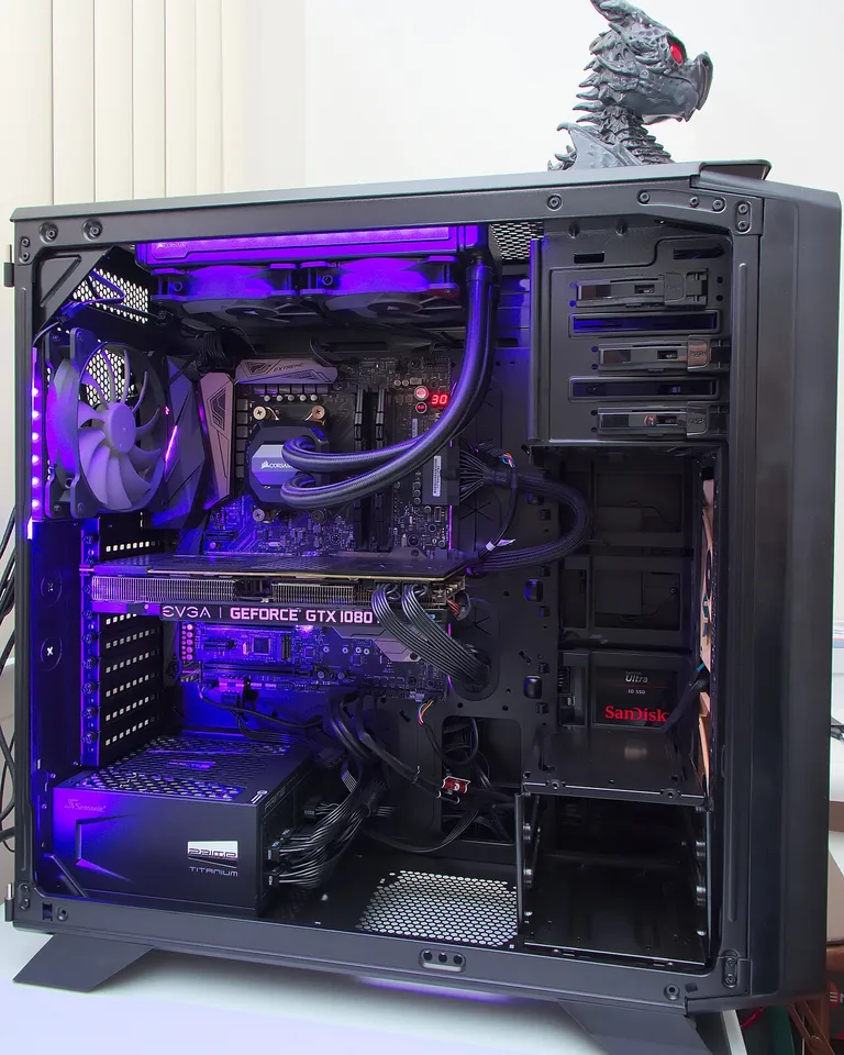 12 Black Gaming Setup Ideas That Look Sleek Without RGB Chaos 4 Black gaming setup with a single cyan LED accent light on the wall