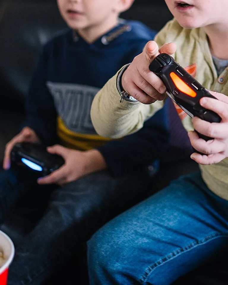 12 Gaming Room Ideas for Couples That Leave Room for Both Players 16 Warm cozy shared gaming space with soft textures and layered lighting