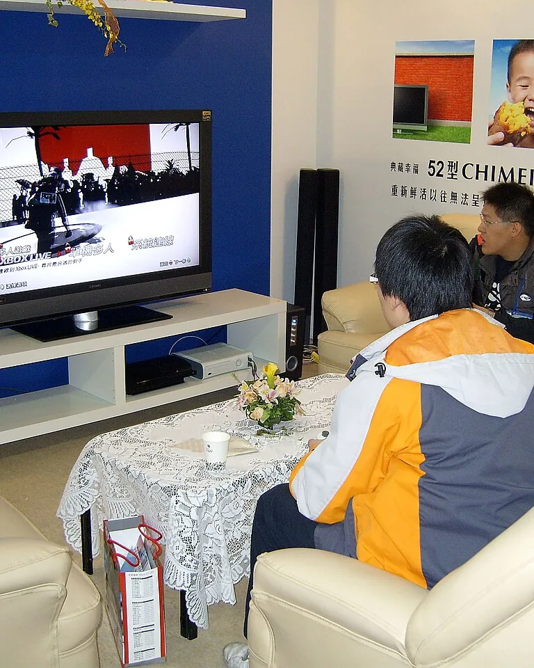 12 Gaming Room Ideas for Couples That Leave Room for Both Players 7 Cozy console gaming corner with sectional sofa and wall-mounted TV