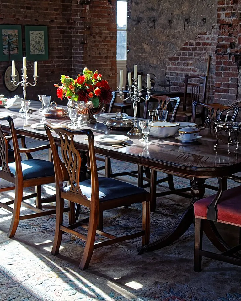 How to Make a Dining Room Look Formal: 12 Ideas That Work in Any Home 10 Large area rug under a formal dining table with chairs