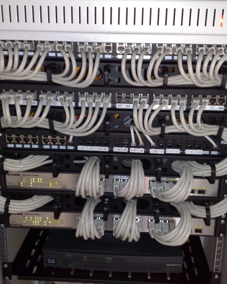 Under-desk tray and velcro ties bundling gaming setup cables