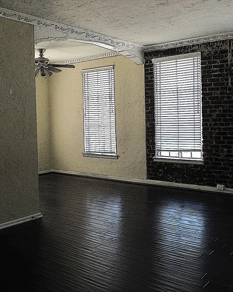 Long narrow living room with sofa floated off the wall and two defined zones