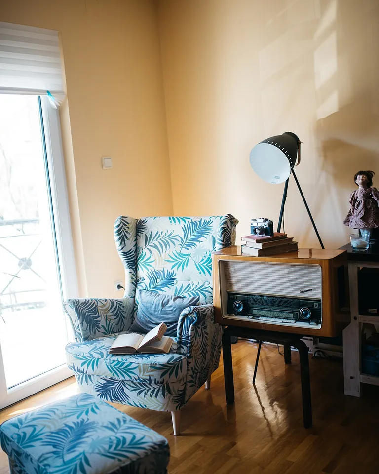 12 Ways to Arrange Furniture in a Long Narrow Living Room (That Actually Work) 15 Cozy reading nook at the far end of a narrow living room